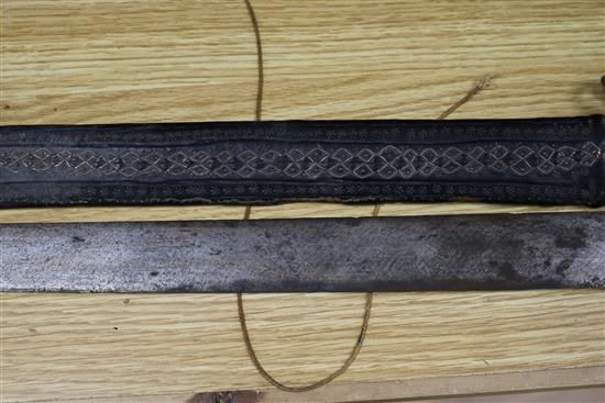 A Songye style ceremonial axe, the wooden handle covered in snakeskin, a Ngala style tribal knife and an Indian long sword,